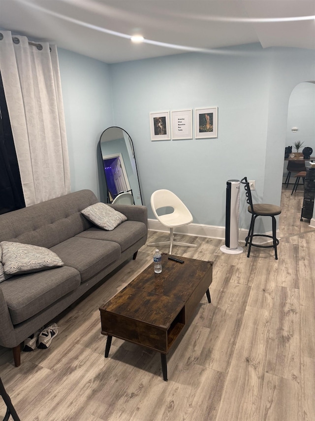 4312 Cottage St, North Bergen, NJ 07047 - living area featuring arched walkways and wood finished floors