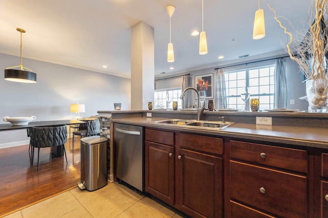 kitchen featuring ornamental molding, light tile patterned flooring, dishwasher, and sink