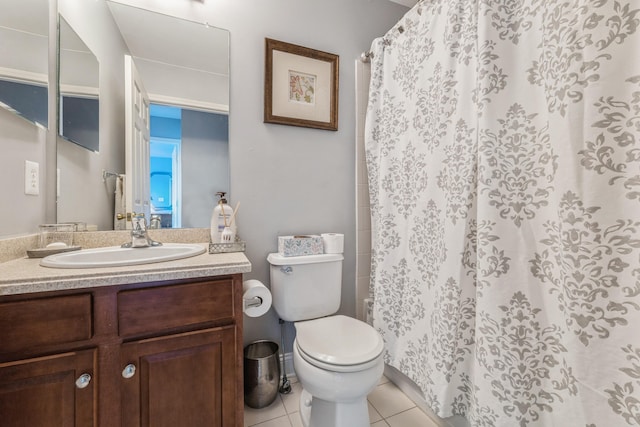 bathroom featuring toilet, tile patterned flooring, curtained shower, and vanity