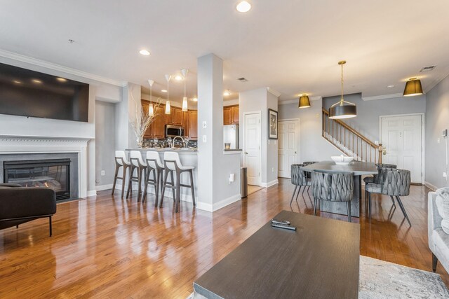 dining area featuring crown molding and dark hardwood / wood-style floors