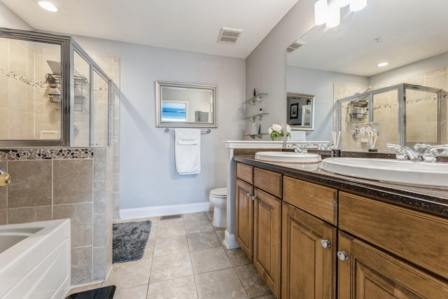 full bathroom with independent shower and bath, vanity, tile patterned floors, and toilet