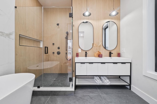 bathroom with vanity, tile patterned floors, and plus walk in shower