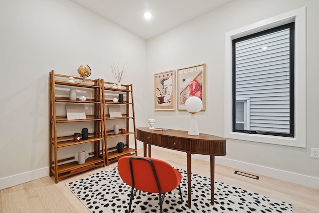 office area with light hardwood / wood-style flooring