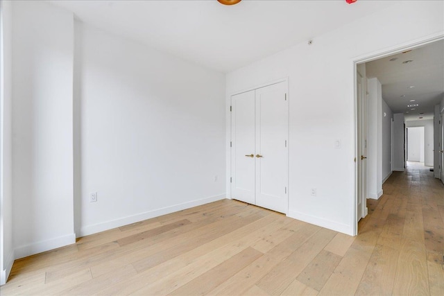 418 Monroe St Unit 201, Hoboken, NJ 07030 - unfurnished bedroom with light wood-type flooring, baseboards, and a closet