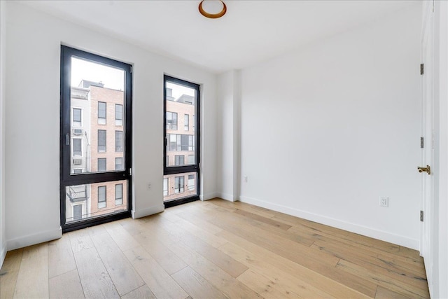 418 Monroe St Unit 201, Hoboken, NJ 07030 - spare room featuring healthy amount of natural light, baseboards, and light wood-style floors
