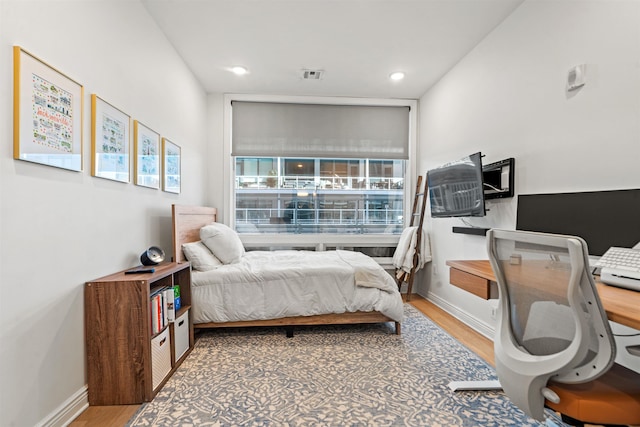 bedroom featuring wood-type flooring