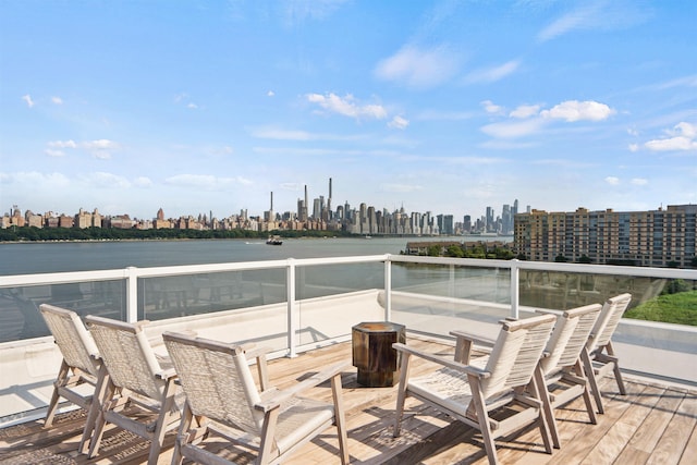 wooden deck featuring a water view