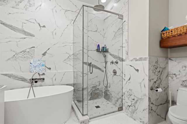 bathroom with tile walls, toilet, and separate shower and tub