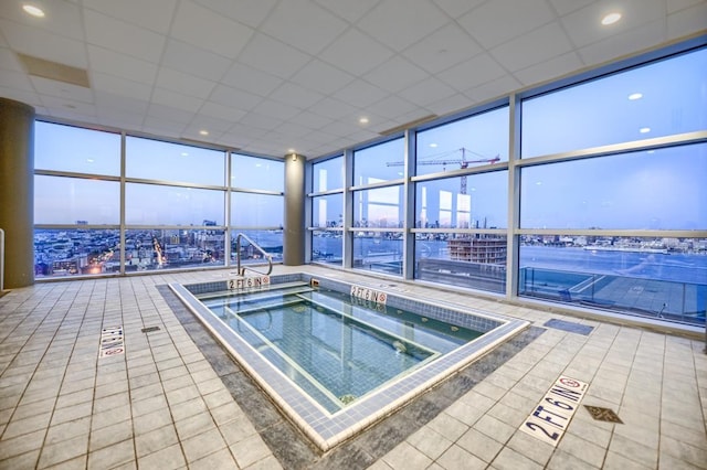 view of swimming pool with a view of city