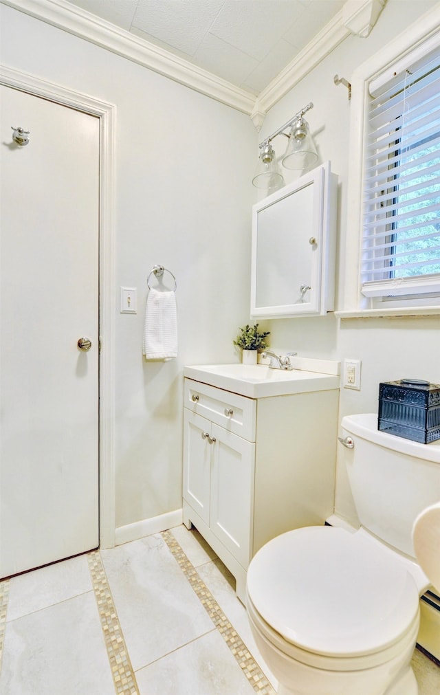 76 Central Ave, Secaucus, NJ 07094 - bathroom featuring ornamental molding, vanity, tile patterned flooring, a baseboard heating unit, and inlaid floor details