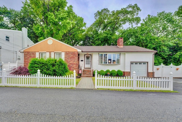 76 Central Ave, Secaucus, NJ 07094 - ranch-style home featuring an attached garage, brick siding, a chimney, and a fenced front yard