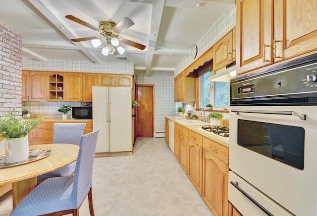 76 Central Ave, Secaucus, NJ 07094 - kitchen with white appliances, light countertops, beamed ceiling, under cabinet range hood, and ceiling fan