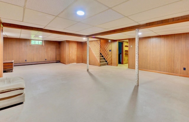 76 Central Ave, Secaucus, NJ 07094 - basement featuring a baseboard heating unit, a drop ceiling, stairway, wood walls, and recessed lighting