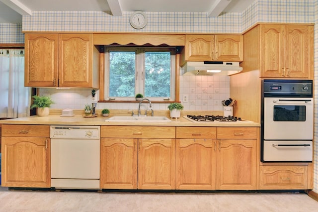 76 Central Ave, Secaucus, NJ 07094 - kitchen featuring white appliances, a warming drawer, wallpapered walls, under cabinet range hood, and light countertops