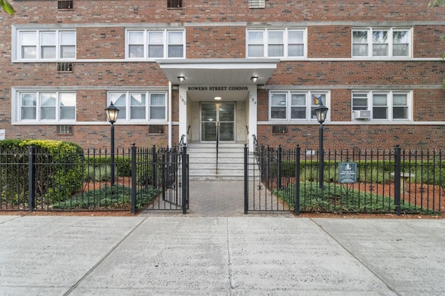 154 Bowers St Unit 2A, Jersey City, NJ 07307 - doorway to property with brick siding and a gate