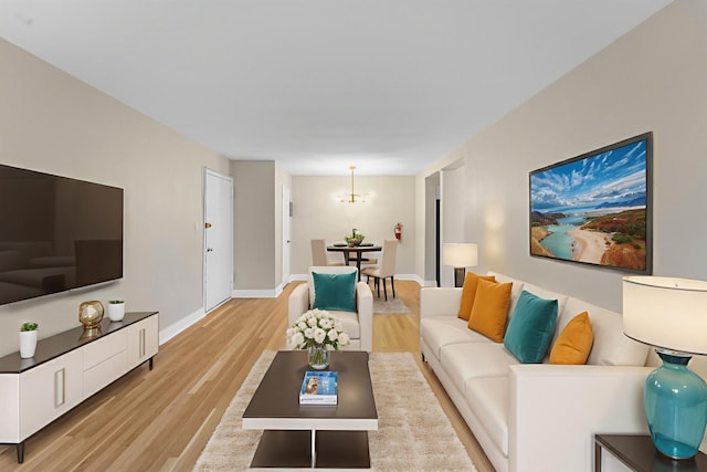 154 Bowers St Unit 2A, Jersey City, NJ 07307 - living area featuring light wood-style floors and a chandelier