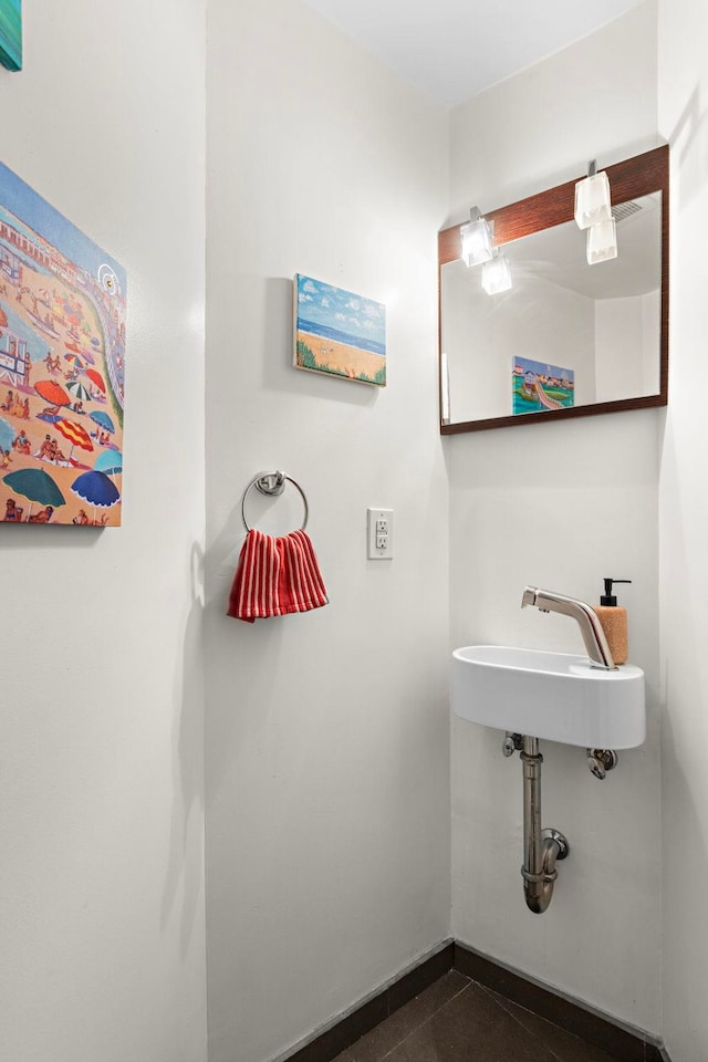 68 Park Ave Unit 3, Hoboken, NJ 07030 - bathroom with a sink and baseboards