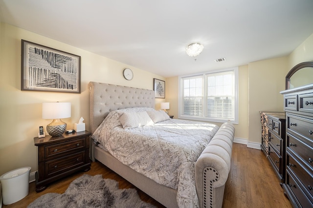 45 Broadway Unit 302, Jersey City, NJ 07306 - bedroom with dark wood-style flooring and baseboards