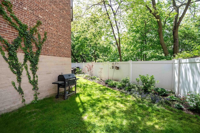 view of yard with a fenced backyard