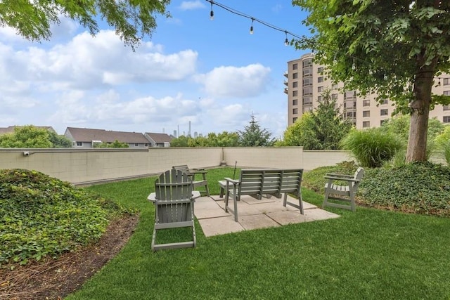 view of yard featuring a patio area and fence