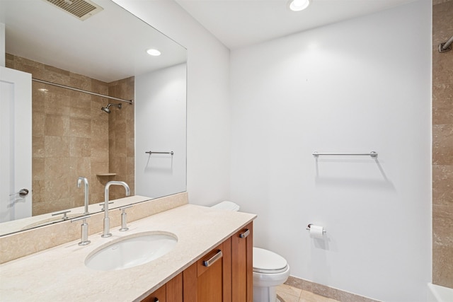 full bathroom with visible vents, toilet, a shower, vanity, and tile patterned floors