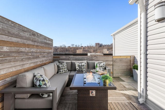 deck with fence and an outdoor living space