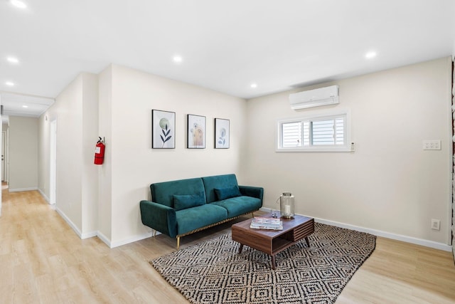 80 E 24th St, Bayonne, NJ 07002 - living room featuring a wall mounted AC, light wood finished floors, baseboards, and recessed lighting