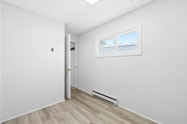 80 E 24th St, Bayonne, NJ 07002 - empty room featuring a baseboard radiator and light wood-type flooring