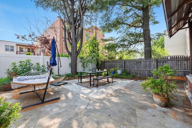 80 E 24th St, Bayonne, NJ 07002 - fenced backyard with a patio and outdoor dining area