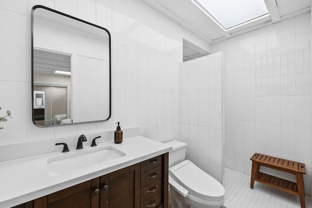 80 E 24th St, Bayonne, NJ 07002 - full bath featuring tile walls, vanity, toilet, and tiled shower