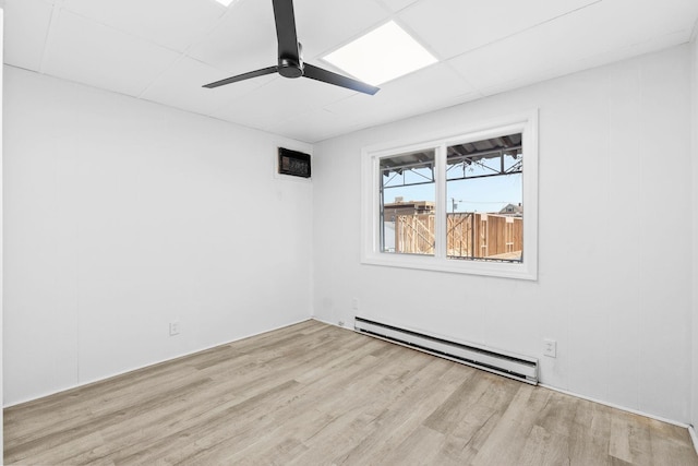 80 E 24th St, Bayonne, NJ 07002 - empty room featuring a baseboard heating unit, ceiling fan, and wood finished floors