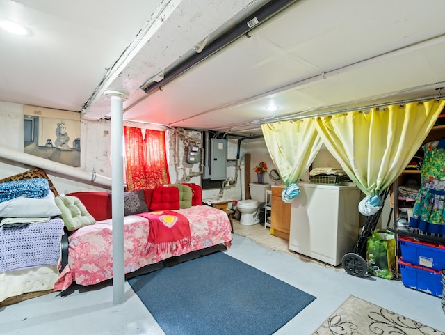 basement with electric panel, washer / clothes dryer, and a sink