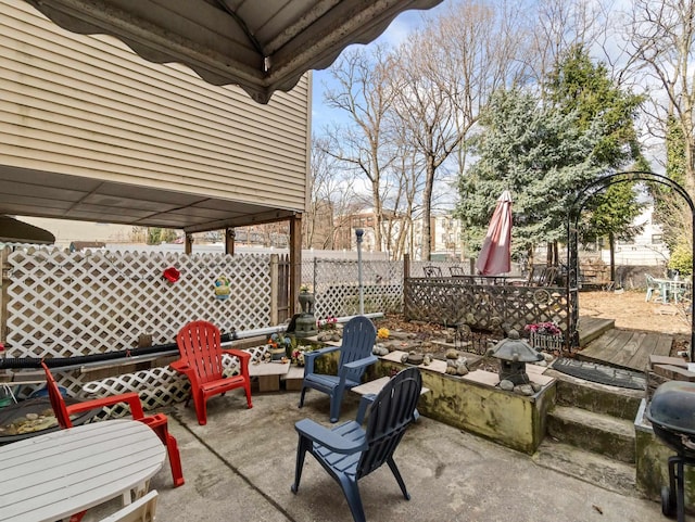 view of patio featuring fence