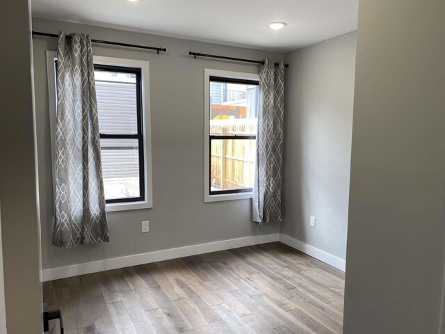41 Beacon Ave Unit 1, Jersey City, NJ 07306 - spare room with wood finished floors and baseboards