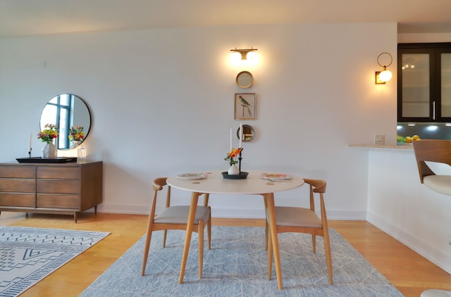 105 Greene St Unit 1101, Jersey City, NJ 07302 - dining space featuring baseboards and light wood-style floors