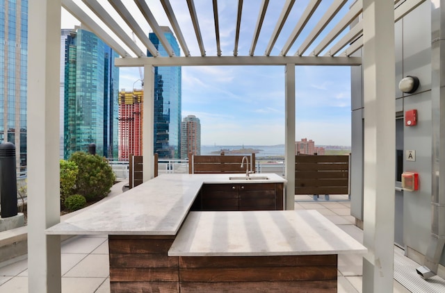 105 Greene St Unit 1101, Jersey City, NJ 07302 - view of patio / terrace featuring a sink, a view of city, and a pergola