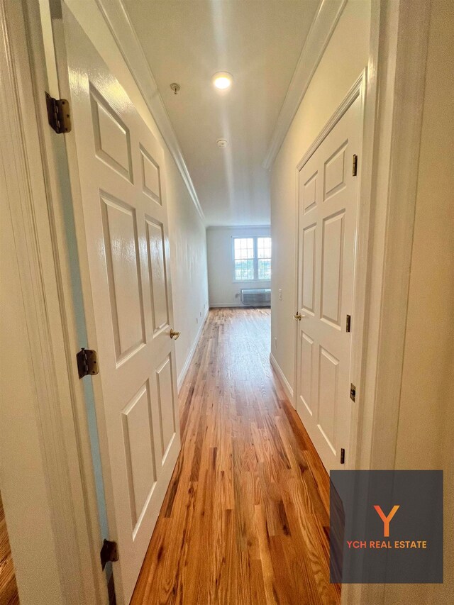 1100 River Rd, Edgewater, NJ 07020 - unfurnished bedroom featuring crown molding, wood finished floors, baseboards, and a closet