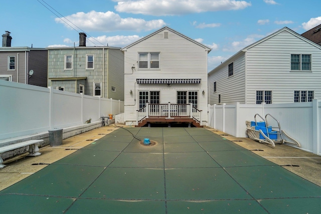 170 W 8th St, Bayonne, NJ 07002 - back of property featuring a fenced backyard and a patio