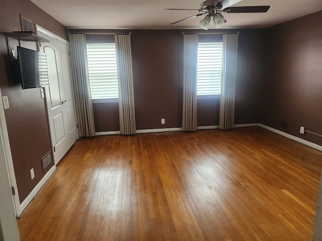 170 W 8th St, Bayonne, NJ 07002 - unfurnished room with ceiling fan, wood finished floors, and baseboards