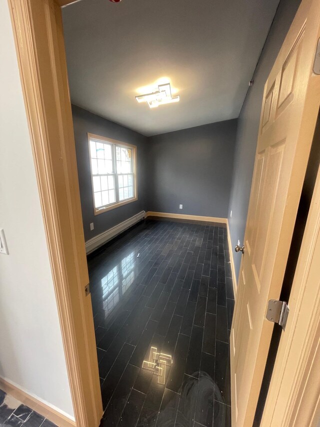 2907 Central Ave, Union City, NJ 07087 - spare room featuring baseboard heating and baseboards