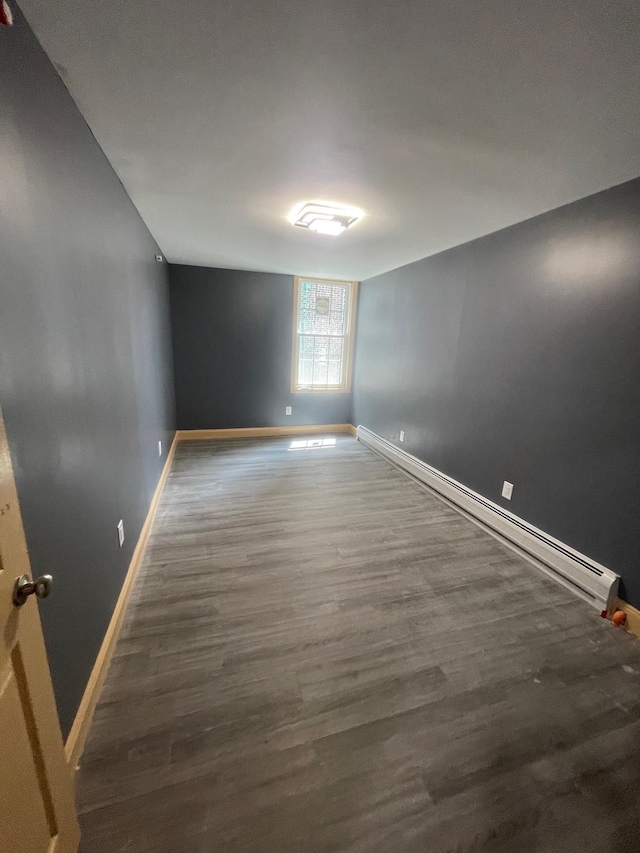 2907 Central Ave, Union City, NJ 07087 - empty room featuring a baseboard radiator and wood finished floors