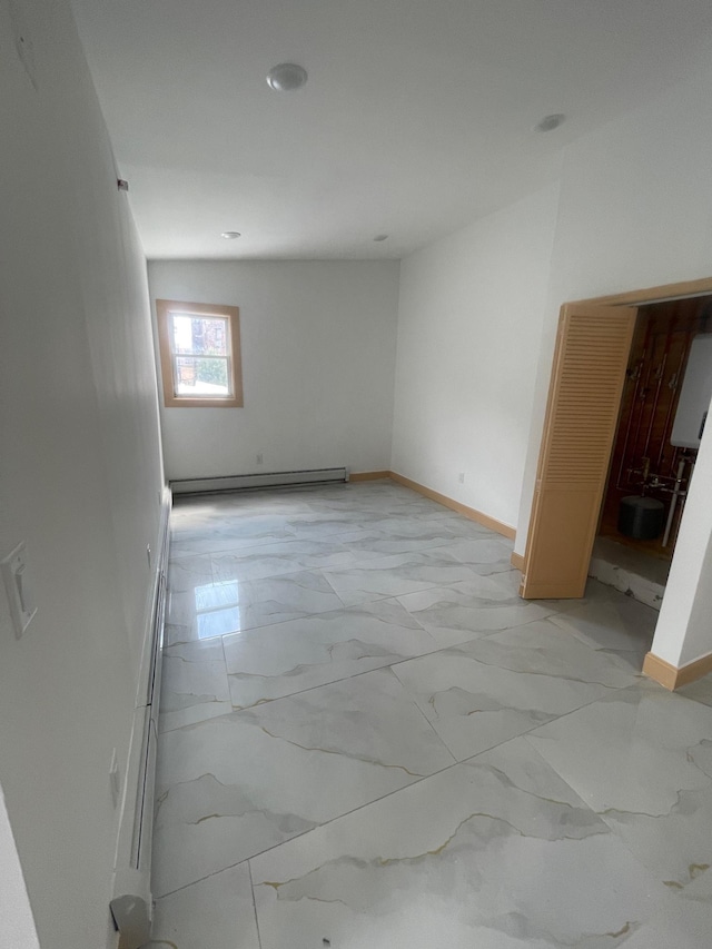 2907 Central Ave, Union City, NJ 07087 - unfurnished room featuring a baseboard radiator, light marble finish floors, and recessed lighting