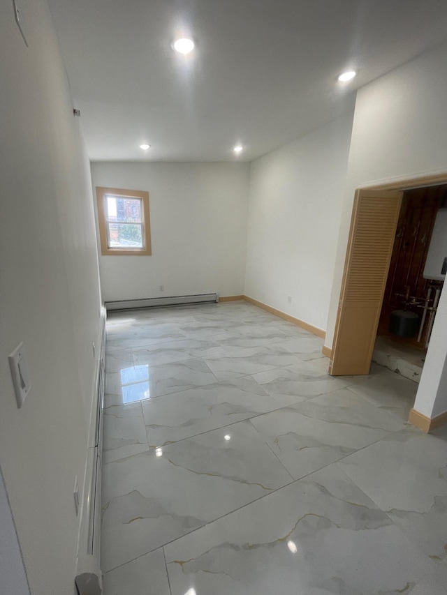 2907 Central Ave, Union City, NJ 07087 - unfurnished room featuring a baseboard radiator, light marble finish floors, and recessed lighting
