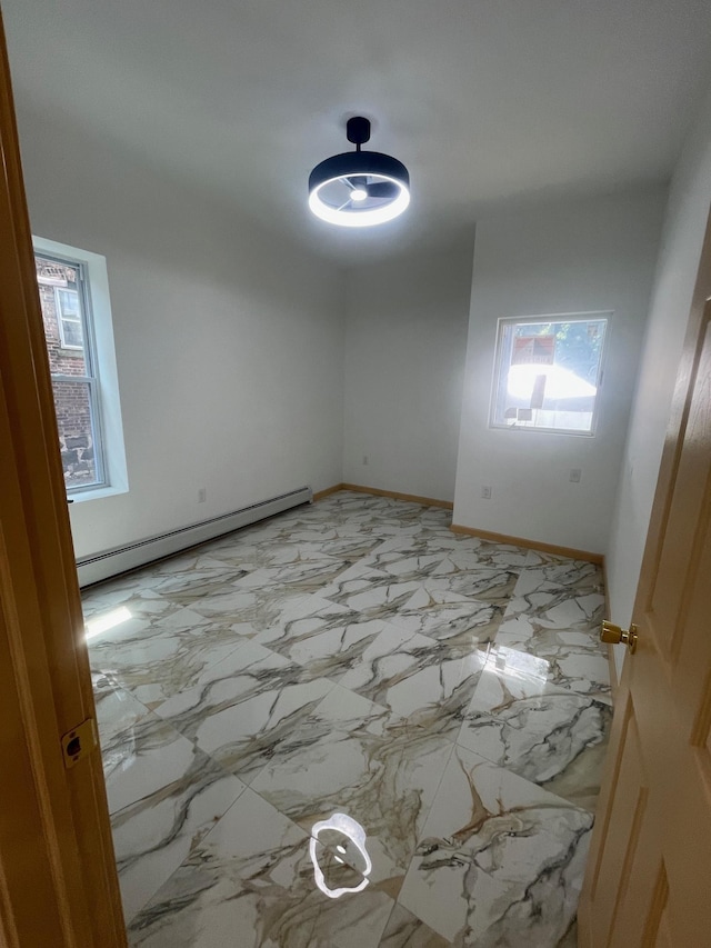 2907 Central Ave, Union City, NJ 07087 - unfurnished room featuring a baseboard radiator and healthy amount of natural light