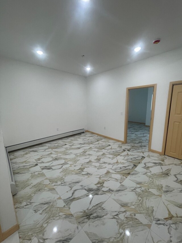 2907 Central Ave, Union City, NJ 07087 - empty room featuring a baseboard radiator and recessed lighting