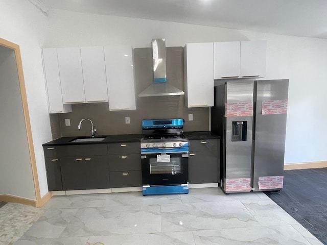 2907 Central Ave, Union City, NJ 07087 - kitchen with appliances with stainless steel finishes, wall chimney range hood, white cabinetry, dark countertops, and vaulted ceiling