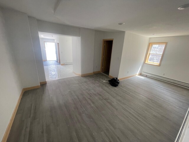 2907 Central Ave, Union City, NJ 07087 - spare room featuring healthy amount of natural light, a baseboard radiator, and light wood-type flooring