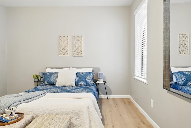 29 51st St Unit A2, Weehawken, NJ 07086 - bedroom with wood finished floors, multiple windows, and baseboards