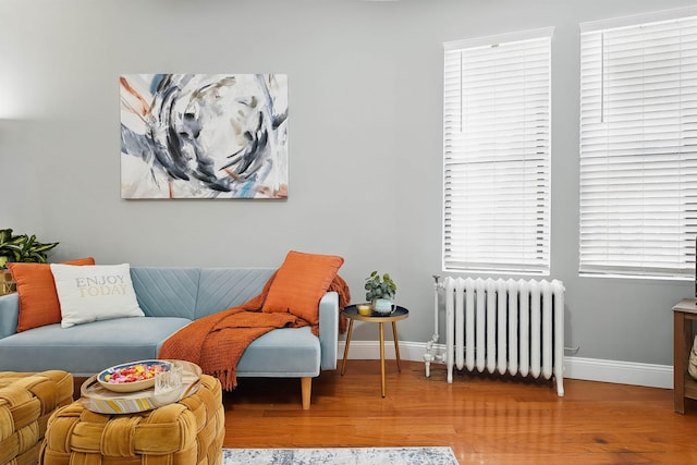 29 51st St Unit A2, Weehawken, NJ 07086 - sitting room with radiator heating unit, baseboards, and wood finished floors