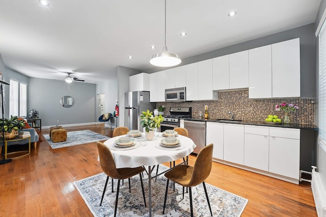 29 51st St Unit A2, Weehawken, NJ 07086 - dining room featuring a ceiling fan, light wood-style flooring, recessed lighting, and baseboards